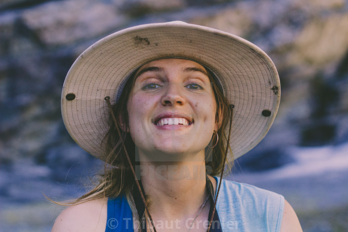 Smiling portrait in front of a glacier
